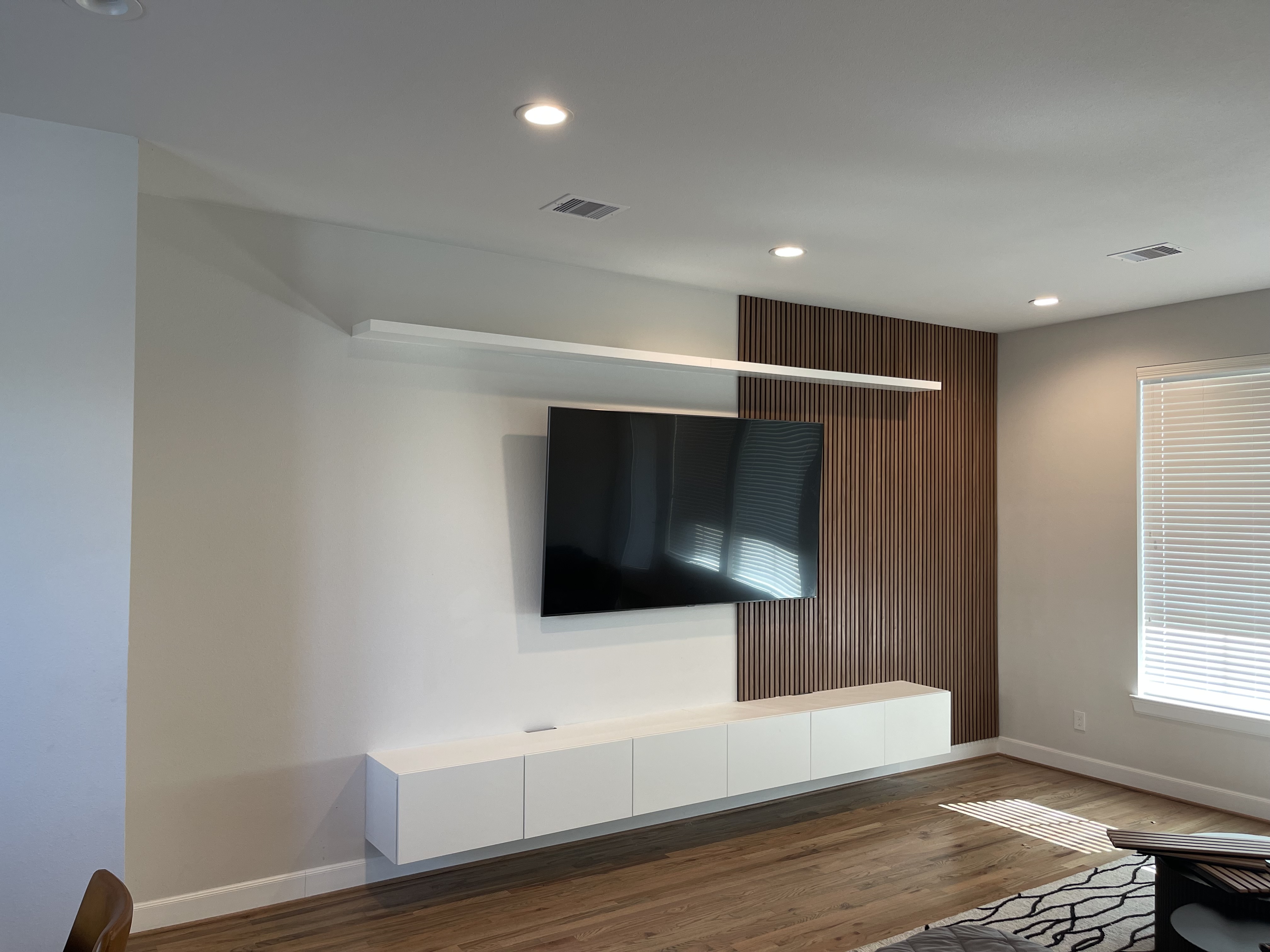 Media wall with wood slat panel — OakVera structural work